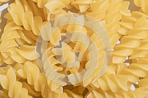 Fusilli Spiral Dry Raw Pasta Background Fusilli pasta italian spiral pattern texture background Traditional italian food