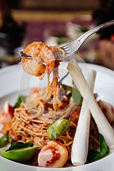 Fusion spaghetti shrimp pasta with Thai Tom Yum Gung spicy sauce