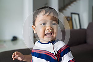 Fussy baby with snots dripping on his face stock photo