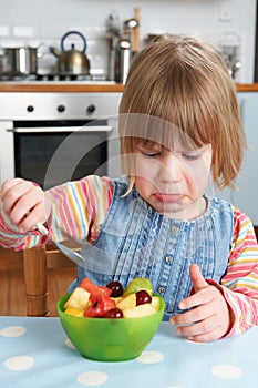 Fussy Child Rejecting Delicious Fruit Salad Pudding