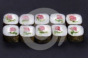 Futomaki sushi roll with tuna and cream cheese, portion of delic