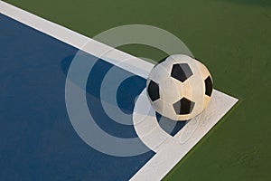 Futsal ball at the corner of field