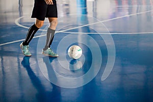 Futsal player control the ball for shoot to goal