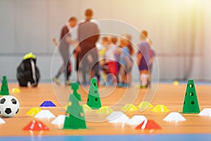 Futsal Soccer Training Court. Kids in a Group With Coaches in Blurred Background photo