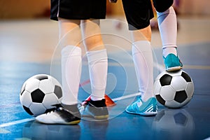 Futsal soccer training. Two young futsal players with balls on training. Close up of legs of futsal players