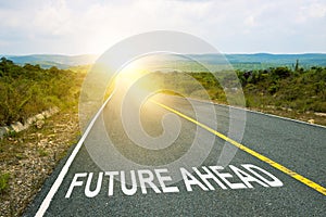 Future ahead, concept photo of asphalt road. Motivational inscription on the road going forward. The beginning of a new path. A