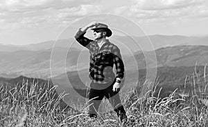 Future. cowboy in hat outdoor. man on mountain landscape. camping and hiking. travelling adventure. hipster fashion