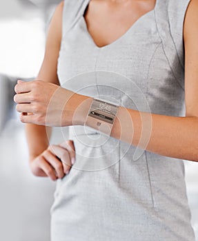 The future has arrived. Closeup studio shot of a businesswomans arm wearing a smartwatch - All screen content is