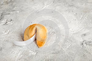 Future prognostic with fortune cookie on stone background mock-up
