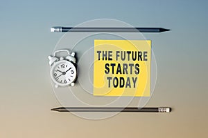 The future starts today - text on sticky note paper. Closeup of a personal agenda. Top view