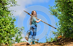 Future success. small girl on rancho. summer farming. farmer small girl. garden tools, shovel and watering can. kid