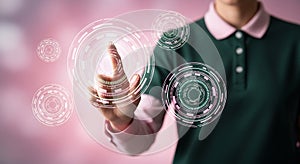 Future technology finger pressing digital button on glowing interface screen