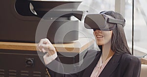 Future VR Education Technology beautiful multi-ethnic woman using virtual reality headset to scroll menu of a restaurant