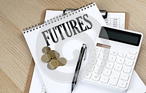 FUTURES text with chart and calculator and coins , business concept