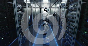 Futuristic android robot working in server room