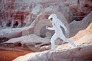 Futuristic astronaut on another planet, image with