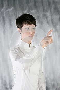 Futuristic businesswoman finger touching pad