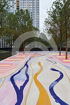 A futuristic city square where kinetic floors convert the silent energy photo