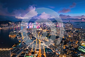 Futuristic cityscape, cyberpunk tone of metropolis, Kowloon, Hong Kong, Night aerial view