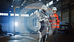 Futuristic Concept of a Manual Labor Worker in a Bionic Exoskeleton Prototype Working in a Factory