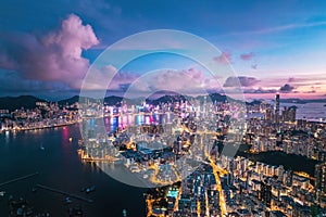 Futuristic cyberpunk view of the famous metropolis, night aerial view of Kowloong Hong Kong