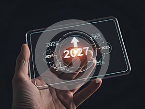 Futuristic data analysis on transparent digital tablet held by hand