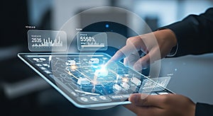 Futuristic digital interface on a tablet displayed with glowing blue graphics and data visualizations