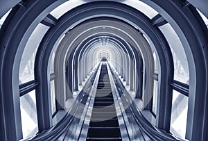 Futuristic escalator in modern tunnel