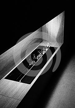 A futuristic fireplace, in black and white