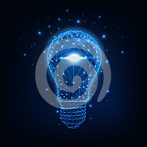 Futuristic glowing low polygonal light bulb isolated on dark blue background.