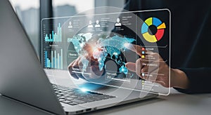 Futuristic holographic interface displaying global data and analytics on a laptop