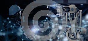 Futuristic industry technology concept, engineer using high technology including 5g, artificial intellingence, robot, augmented mi