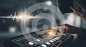 Futuristic interface with sound wave visualization and hand interacting with control panel