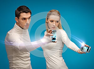 Futuristic man and woman working with gadgets