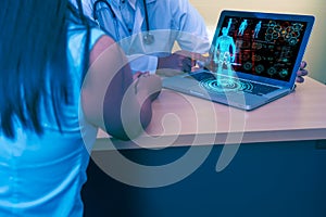Futuristic medical healthcare with artificial intelligence or AI technology concept,doctor diagnostic patient via computer laptop,