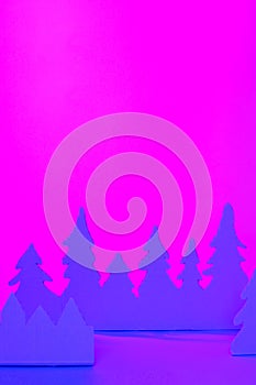 Futuristic modern abstract happy New Year 2022, Merry Chrstmas concept. Pine tree from paper on neon bright violet blue background