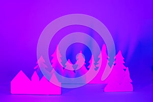 Futuristic modern abstract happy New Year 2022, Merry Chrstmas concept. Pine tree from paper on neon bright violet blue background