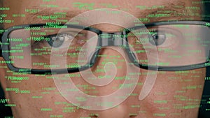 Futuristic monitor on face with code and information hologram. Eye hud animation. Future concept. Man face in glasses.