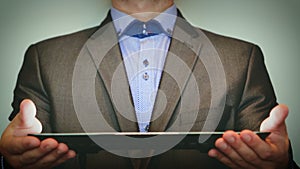 Futuristic portrait of a businessman uses a career chart, a hologram, a diagram, in a suit, makes a finger click. Concept: future,