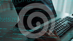 Futuristic programming scene showcasing computer coding with glowing text on screen, hands typing on keyboard in modern