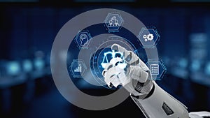 Futuristic robotic hand interacting with digital interface displaying technology concepts and data, symbolizing