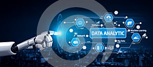 Futuristic robotic hand interacting with data analytics interface showcasing machine learning, big data, network and