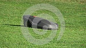 Futuristic robotic lawn mower cuts grass