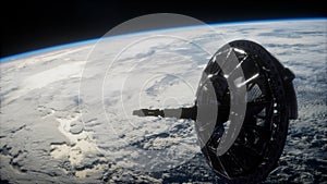 Futuristic space satellite orbiting the earth