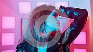 Futuristic style portrait in blue and purple light.