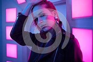 Futuristic style portrait in blue and purple light.