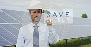 A futuristic technical expert in solar photovoltaic panels, selects the `Save energy` function using pure renewable energy. The co