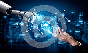 Futuristic Technology Collaboration Between Human Hand and Robotic Arm with Digital Icons Representing Cloud Computing