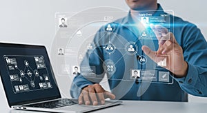 Futuristic technology man interacting with digital interface and laptop ai data network