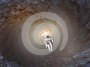 Futuristic view of space walk cosmonaut into spiral galaxy